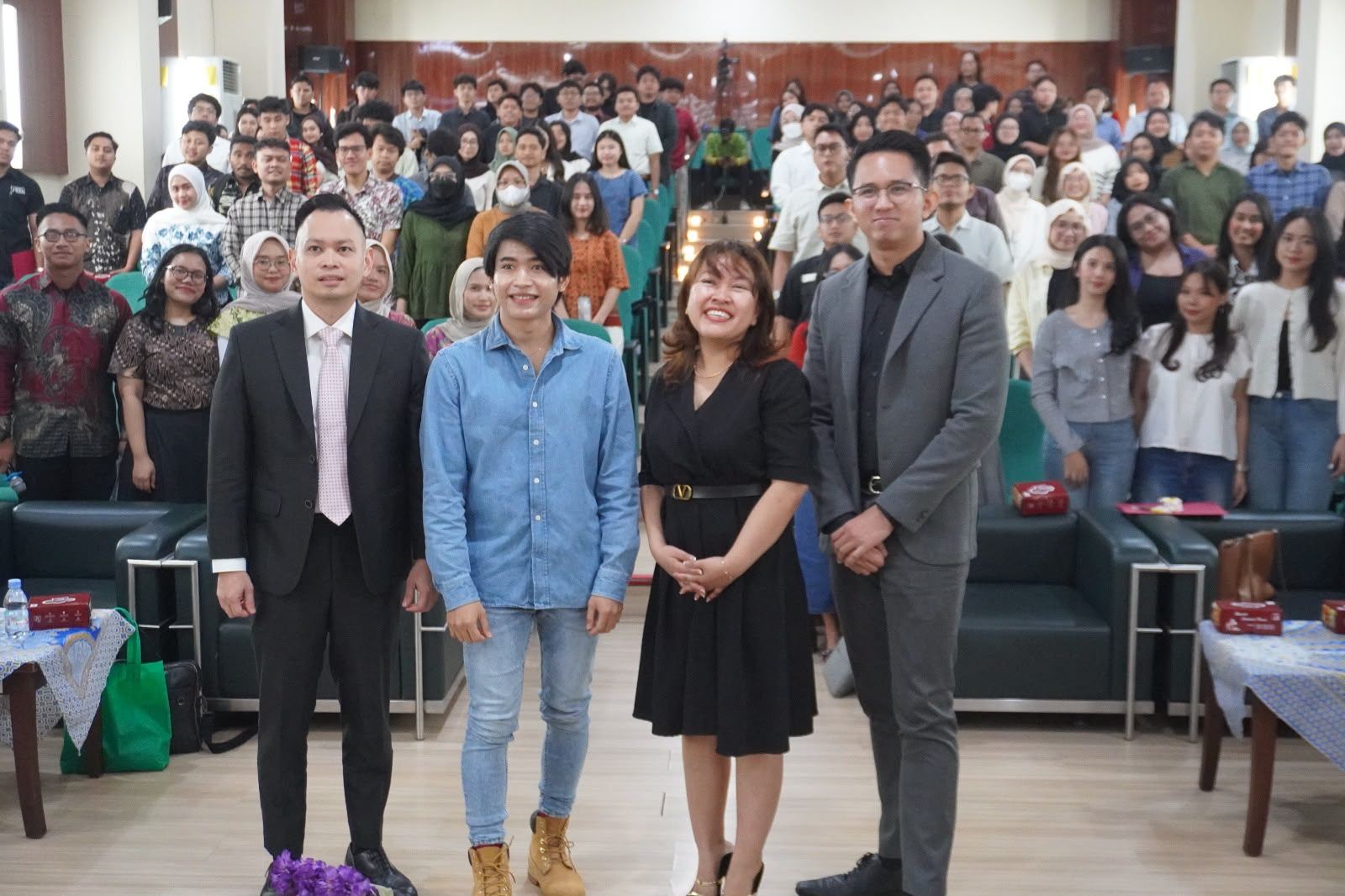 Dr. (Cand.) Putu George Matthew Simbolon, S.H., M.H. (right) with fellow speakers before a full auditorium at UPN Veteran Jakarta